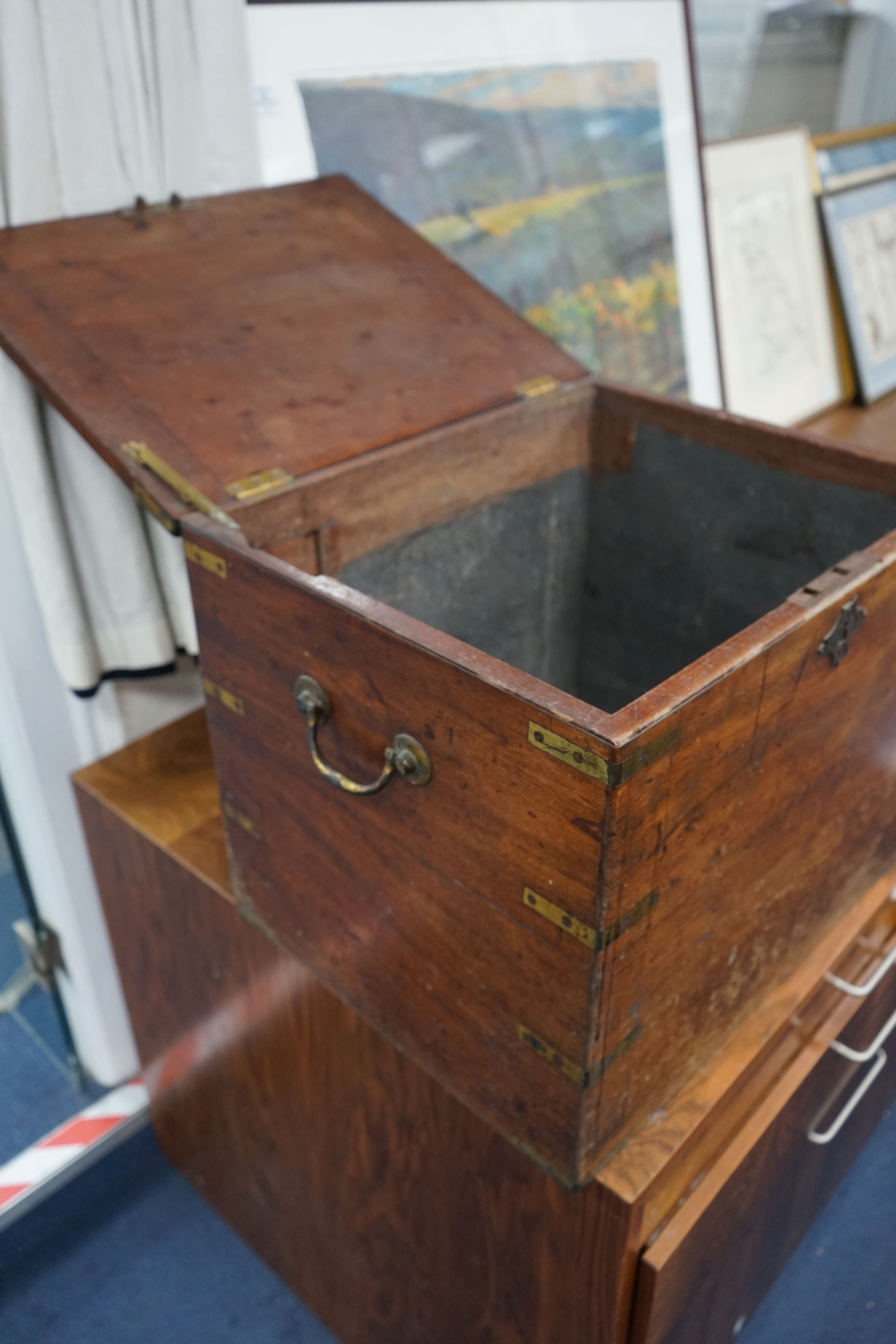 A 19th century brass-bound teak campaign trunk, having hinged top and side mounted carrying handles, width 55cm, depth 43cm, height 44cm